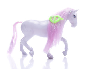 Little pony with pink mane isolated on white