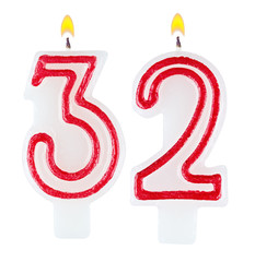 Birthday candles number thirty two isolated on white background
