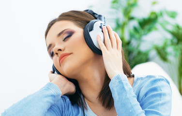 Dreaming young woman listening music