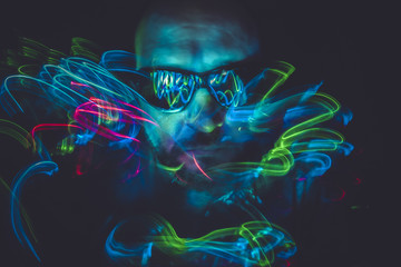 effect lightpainting man with sunglasses and colored lights