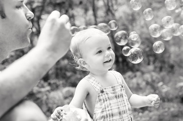 father playing with his son