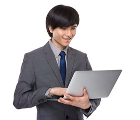 Young businessman look at laptop computer