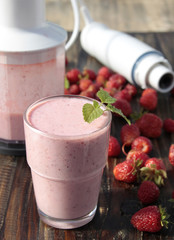 Cocktail of yogurt with strawberries, strawberries in a basket a