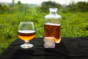 Bottle with a glass of brandy