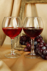 composition of frame,wine and grapes on bright background