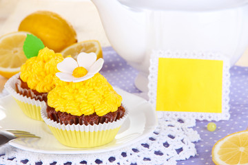 Beautiful lemon cupcakes on dining table close-up