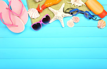 Few summer items on wooden background