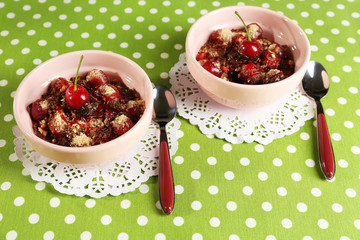 Tasty cherry dessert on table