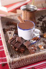 Cup of hot chocolate on table, close up
