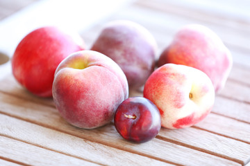 Juicy fruits on wooden table, close-up