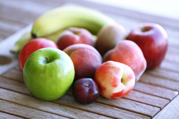 Juicy fruits on wooden table, close-up
