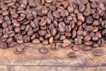 Coffee beans on rustic wooden background