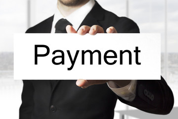 businessman holding sign payment