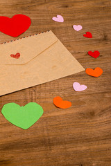 brown envelope and paper heart