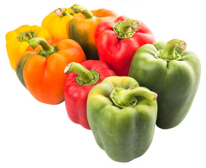 A group of different colors of capsicum over white background