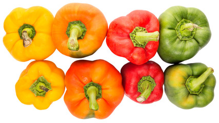 A group of different colors of capsicum over white background