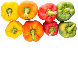 A group of different colors of capsicum over white background