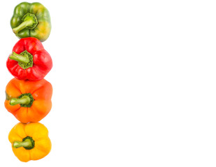 A group of different colors of capsicum over white background