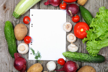 Fresh vegetables and a paper for recipe