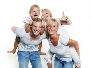 Parents giving piggyback ride to children