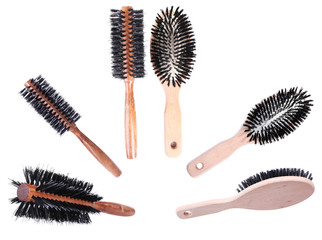 Collage of wooden hairbrushes isolated on white