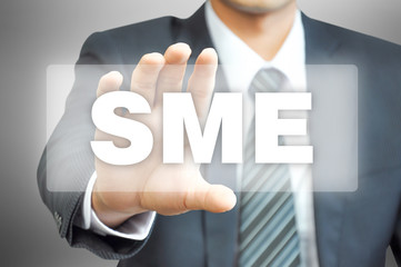 Businessman hand holding virtual screen with SME sign