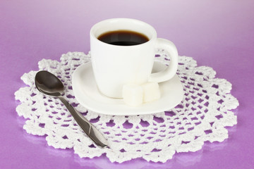 A cup of strong coffee on purple background