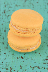 Macaroons on wooden table close-up