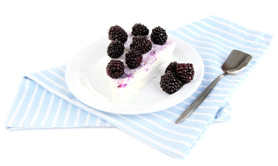 Cheesecake with fresh berries on white plate isolated on white