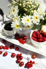 Still life with berries and flowers
