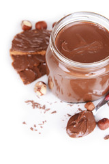 Sweet chocolate cream in jar isolated on white