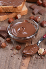 Sweet chocolate cream in bowl on table close-up