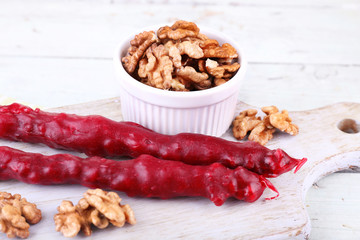 Tasty oriental sweets (churchkhela) and fresh nuts,