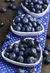 Delicious blueberries on table close-up