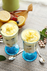 Tasty lemon desserts on table at home