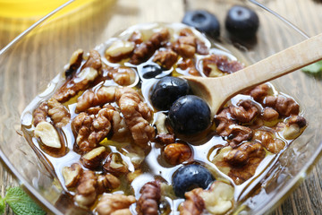 Fresh snack with honey on wooden table