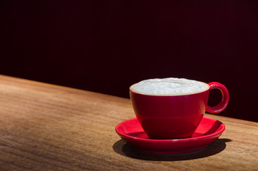 coffee mug with frothed milk at the bar