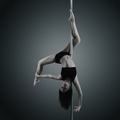 pole dancer, young woman dancing on pylon, toned and noise added