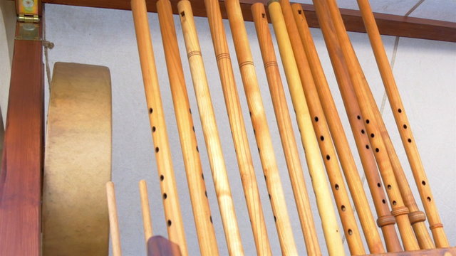 Lots of wooden flutes on display on the rack GH4 4K UHD