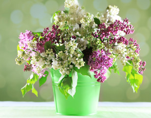 Beautiful lilac flowers in vase,
