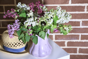 Beautiful lilac flowers in vase,