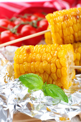 Grilled corn cobs on table, close-up
