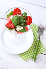 Salad with watermelon, feta cheese, arugula, tomatoes, sesame