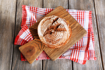 Fresh baked bread, on wooden background