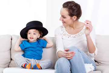 Mother and child wearing hat