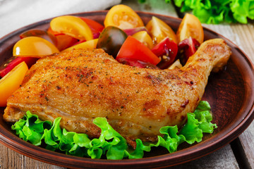 baked chicken leg with tomatoes
