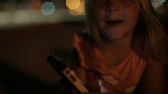 my daughter playing with the phone. israel. Ashdod.