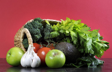 Shopping basket full of fruit and vegetables.