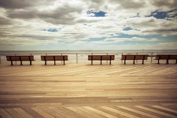 Papier Peint photo autocollant Descente vers la plage Vintage tone seaside boardwalk with benches