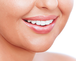 Closeup image of a young womans lips and teeths